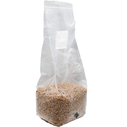 3 pound grow bag of white milo mushroom substrate standing facing right